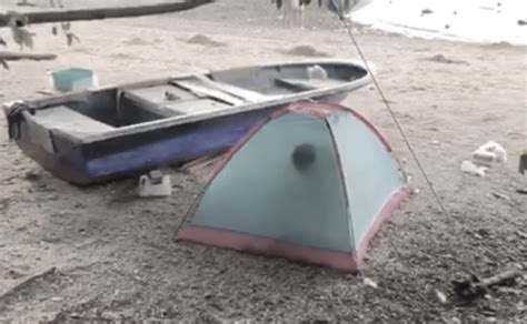 Couple making out in the tent on Wu Kai Sha Beach.